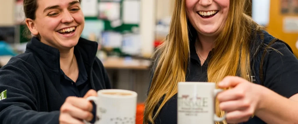 two farm vets off duty having a cup of tea